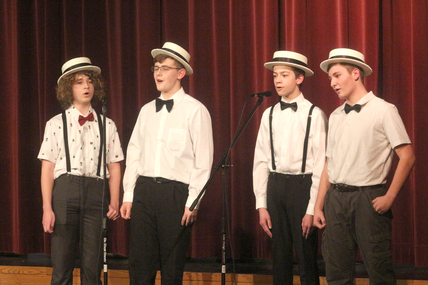 The barbershop quartet of (from left) Jarrett TeBockhorst, Henry Yoder, Hayden Bailey and Jack Greiner sing “Baby on Board" at the Mid-Prairie Middle School choral concert on Tuesday, Feb. 25.